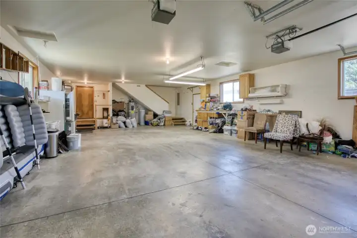 4 car garage with access to finished room above.