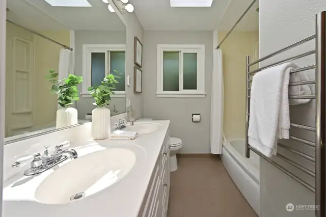 Huge bathroom with 2 sinks and GORGEOUS SKY LIGHT!