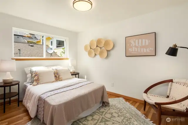 Bedrooms on the main floor include hardwood floors and large closets.