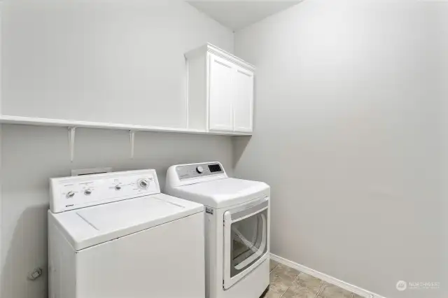 Laundry room with shelving and storage.all appliances stay