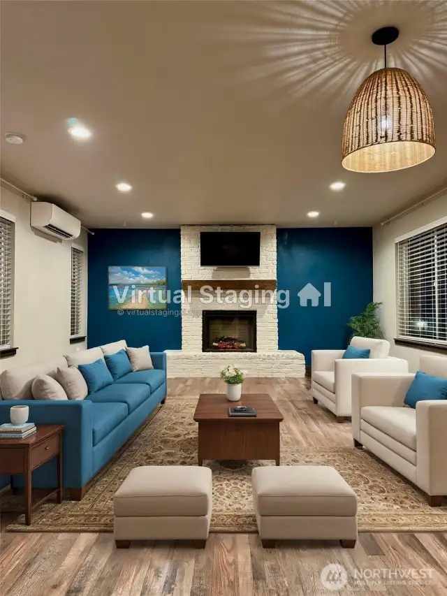 Living Room has Electric Fireplace and upgraded brick exterior and Mantle.