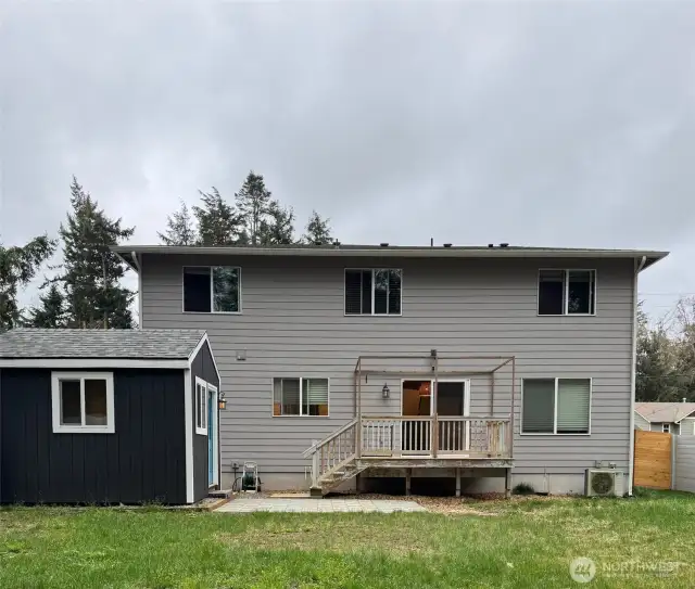 Back yard view with Home Office or Storage.