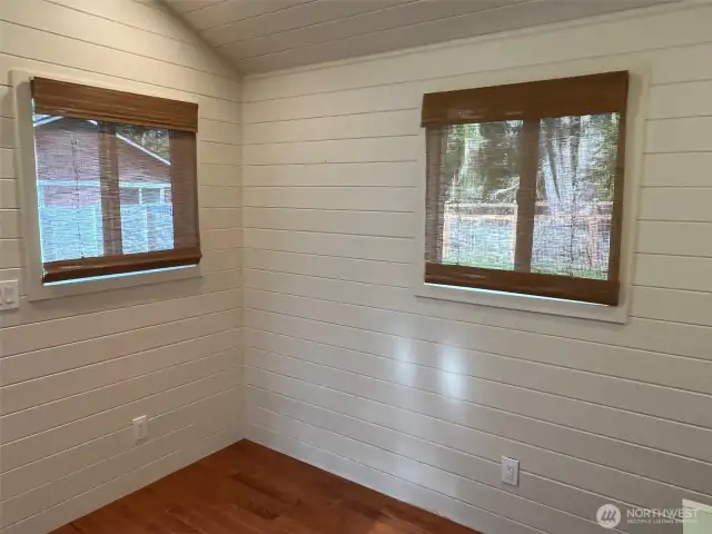 Recessed lighting, Tongue and groove flooring and custom shiplap walls.