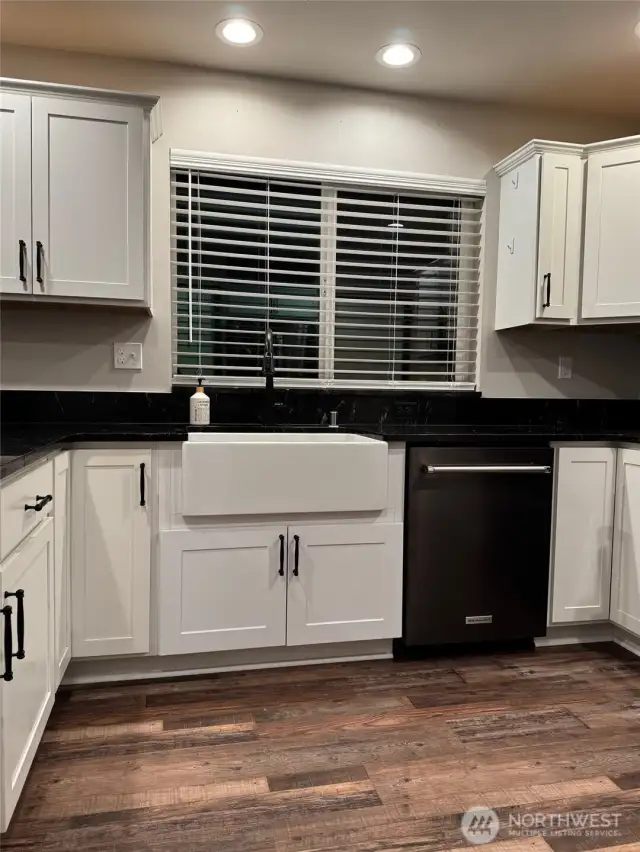 Kitchen has upgraded Apron-Front Farm House Sink with metal grid.