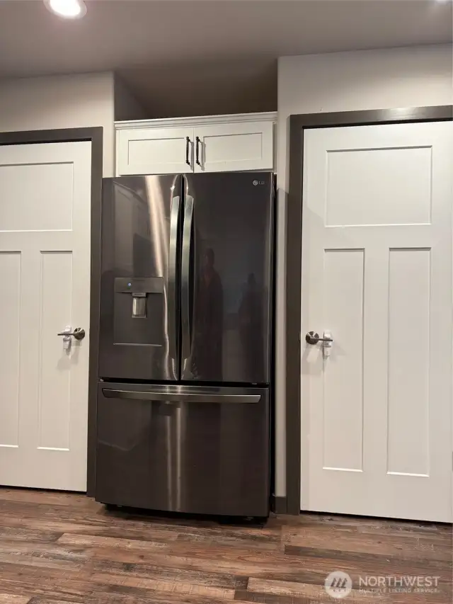 Double Kitchen pantries with shelving.