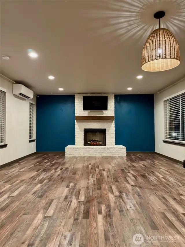 Living Room has Electric Fireplace and upgraded brick exterior and Mantle.