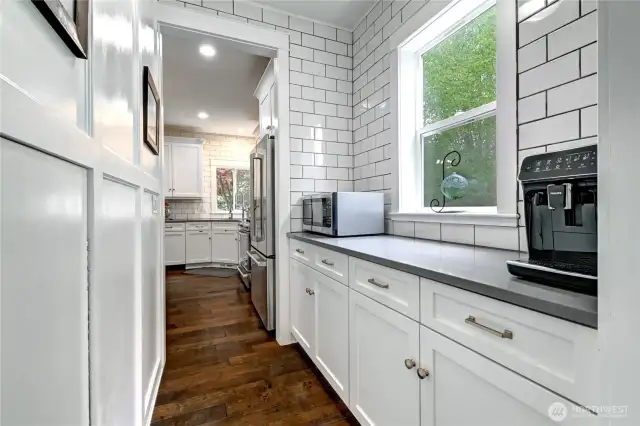 Serving kitchen/prep pantry with extra storage under the stairs