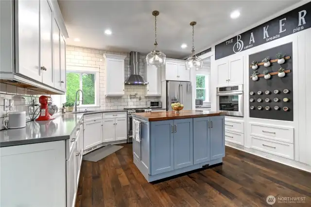 View of kitchen from eating space.  Plenty of storage and cabinetry.