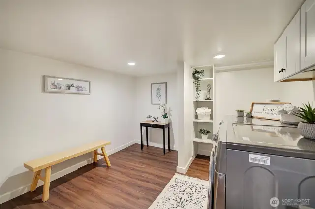 Laundry room has space for storage or crafts.