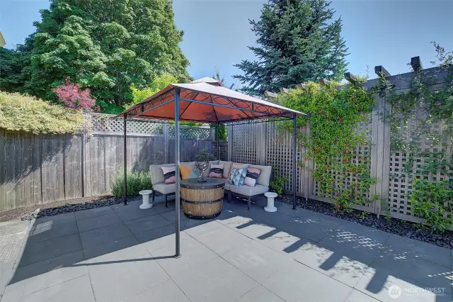 Large rear yard with patio space for entertaining.