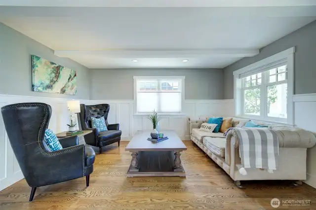 Beautiful, open living room with period millwork.