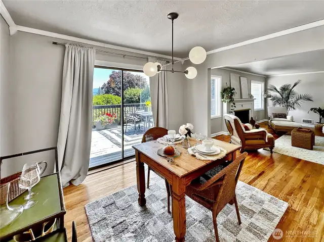 Formal dining room with oak floors and slider access to the large deck.