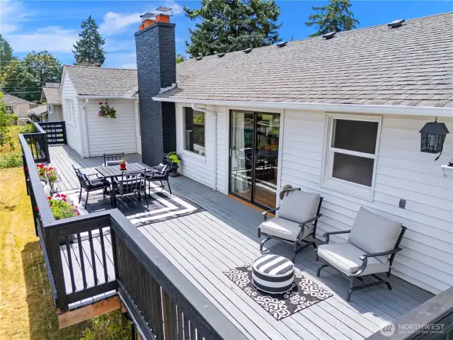 Ample deck with room for table and chairs and additional sitting space.