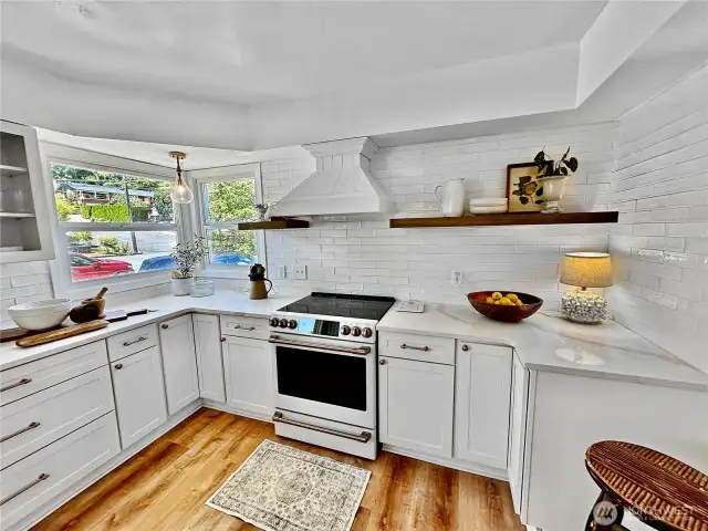 Another view...this shows the quartz counters with full height tile back splash.