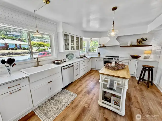 The center island is movable and offers extra workspace and storage.