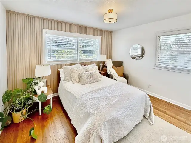 Another view of the 1st bedroom on the main showing the wood accent wall.