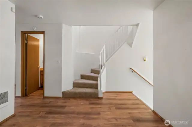 Spiral staircase leads to upper floor.