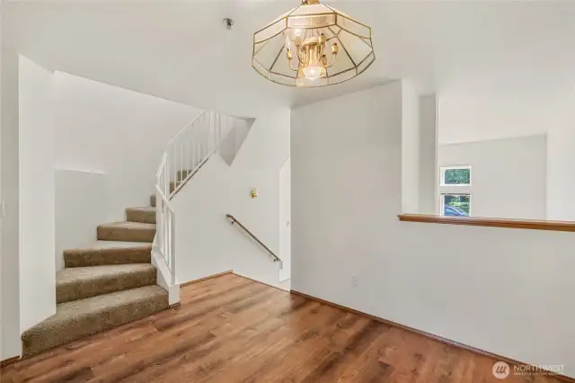 Mezzanine dining formal dining room with spiral staircase to bedrooms.