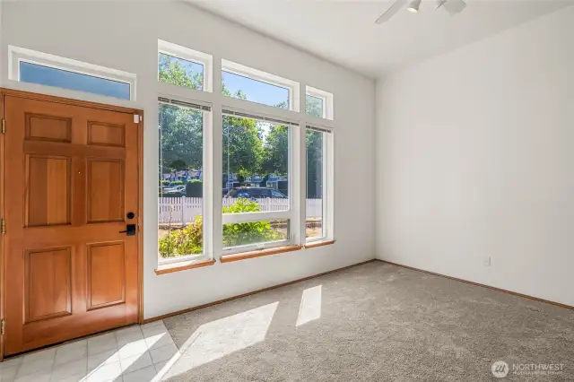 New door and window in living room face east for morning sun.