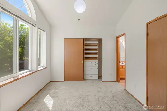 East-facing bedroom with closet insert and ensuite bathroom.