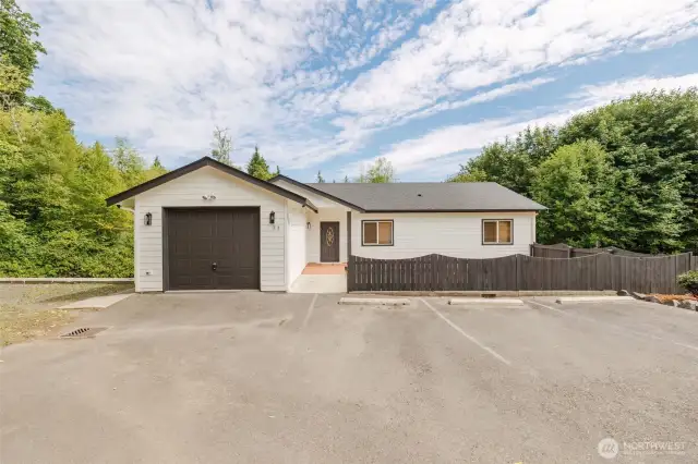 Spacious driveway with plenty of parking for vehicles or guests