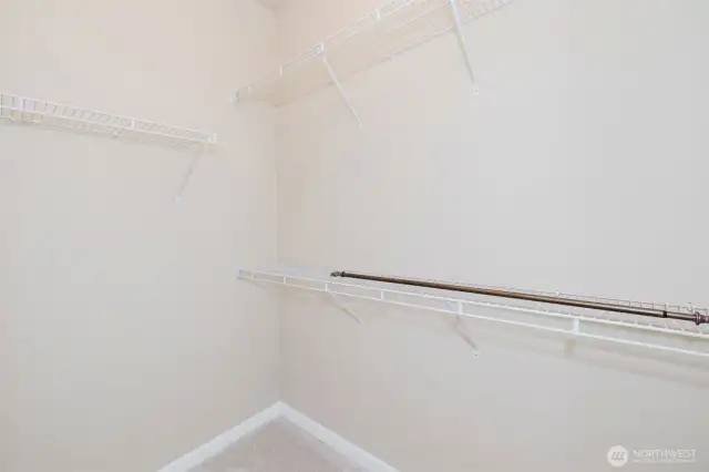 Large walk-in closet with built-in shelving