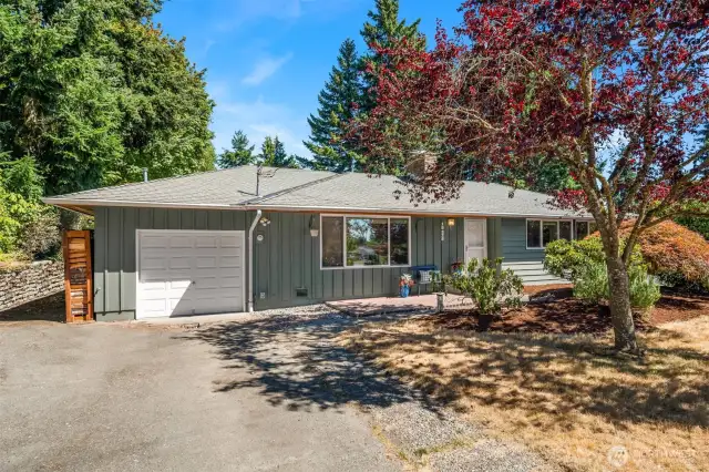 An attached garage and plentiful driveway parking.