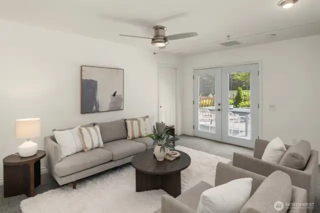 Second living area with French doors leading to the deck.