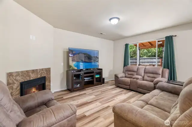 Cozy up by the electric fireplace.