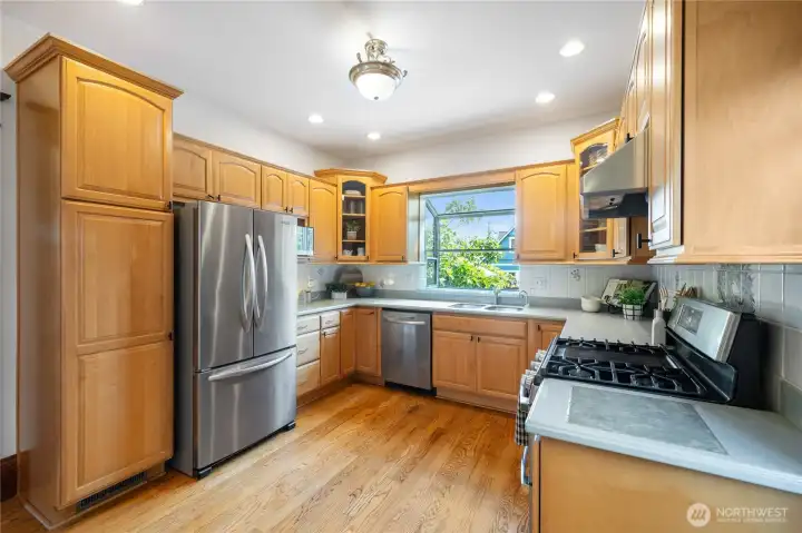 eat-in kitchen overlooks back yard and has side door access