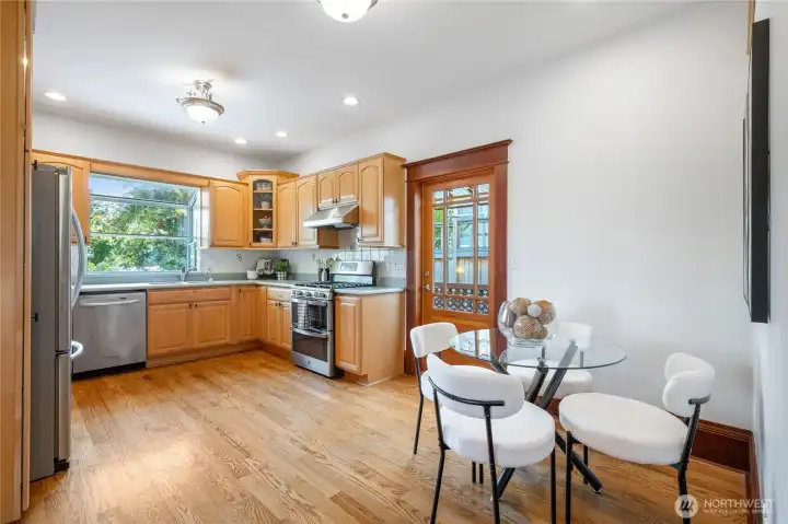 eat-in kitchen overlooks back yard and has side door access