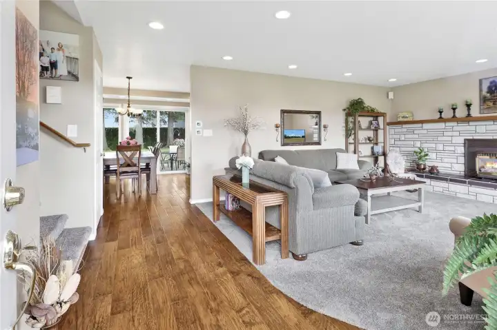The moment you step inside, you’re welcomed by a bright and inviting living room centered around a cozy gas fireplace. Every detail of this home has been meticulously maintained, creating a warm and comfortable first impression.
