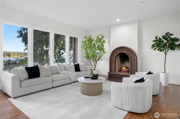 The kitchen flows seamlessly into the living room, complete with a brick gas fireplace to stay warm while watching boats on the water