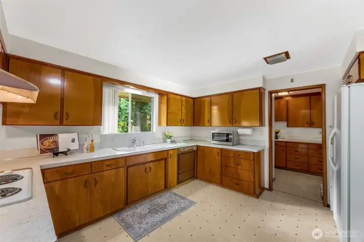 Plenty of counter space in kitchen with window overlooking the back yard.