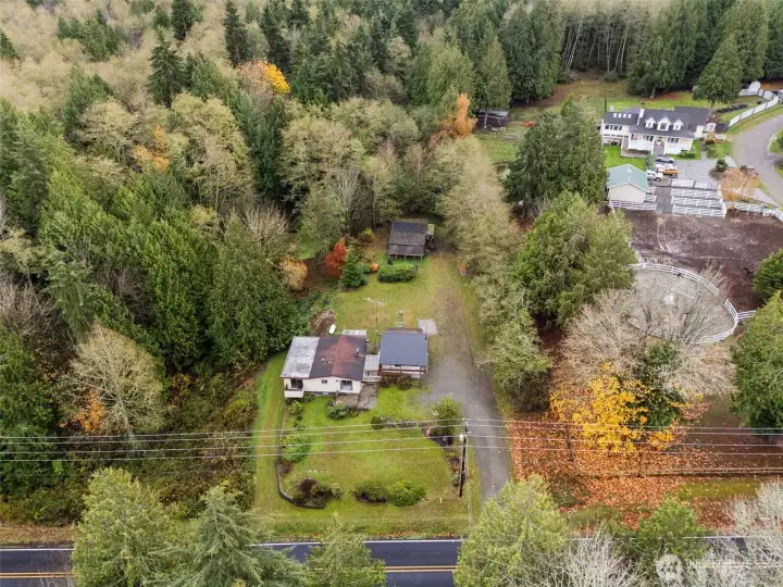 Plenty of privacy on this acreage- surrounded by trees!