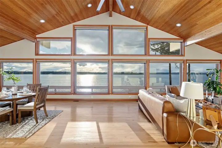 Expansive windows fill the living space with natural light and provide unobstructed waterfront and Olympic Mountain views.