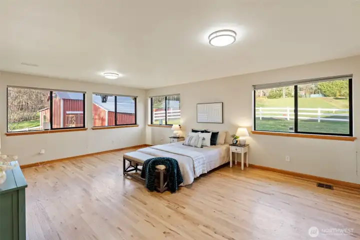 Main-level bedroom with flexible entry through hallway or walk-in closet.