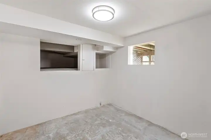 Additional storage room offering versatile space.