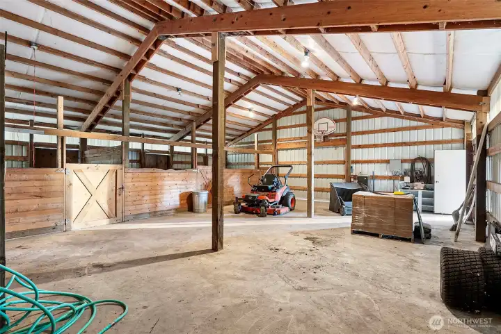Barn with 3 stalls, providing versatile space for livestock or storage.