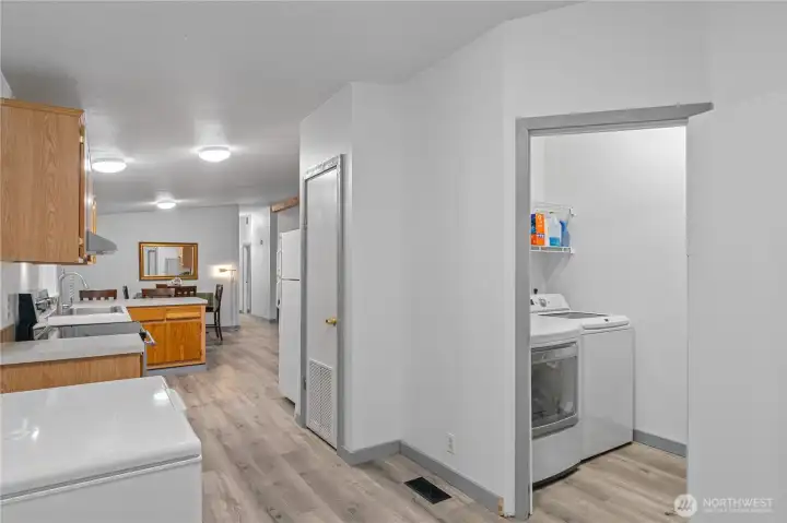 Another view to kitchen from backdoor area showing laundry room