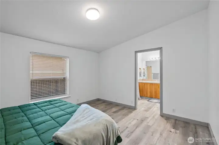 Primary bedroom showing entrance to full bathroom