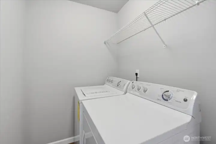 Designated laundry room is conveniently located on the same floor as the bedrooms.