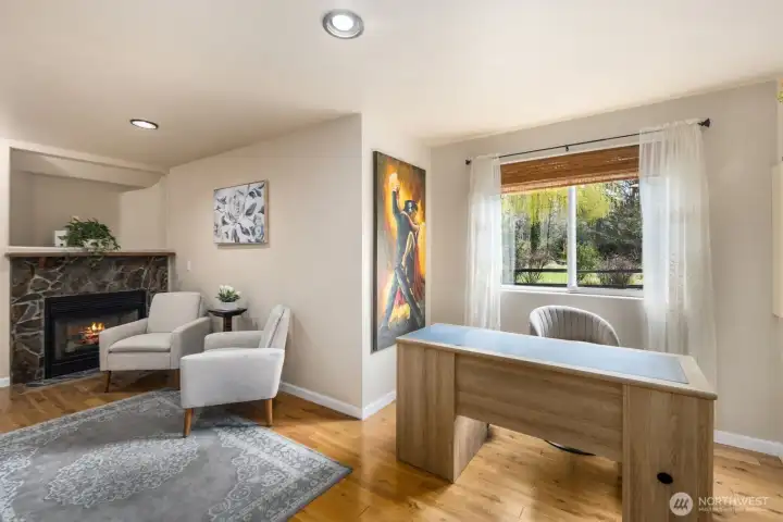 The wall behind chairs can be removed to connect ADU with the main house.