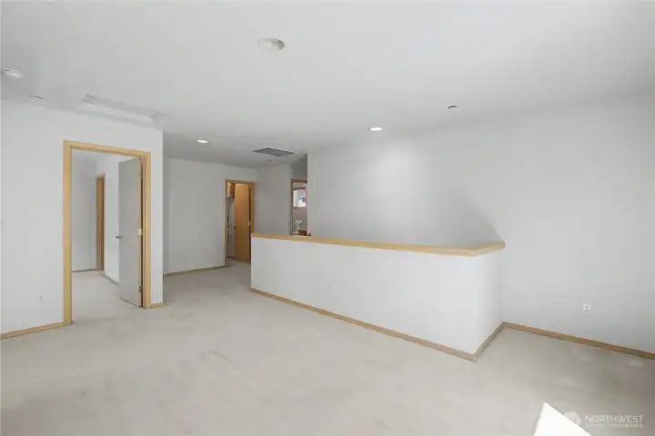Staircase up to your large loft. The Primary suite faces the rear and the two bedrooms face the front.
