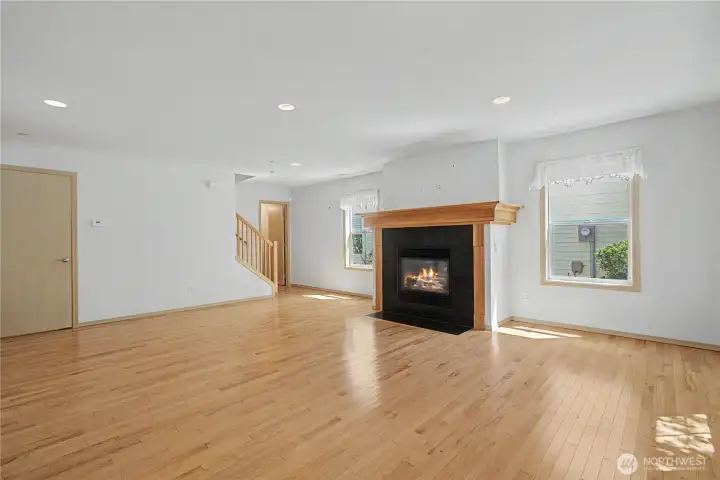 Living with a half bath at bottom of staircase.