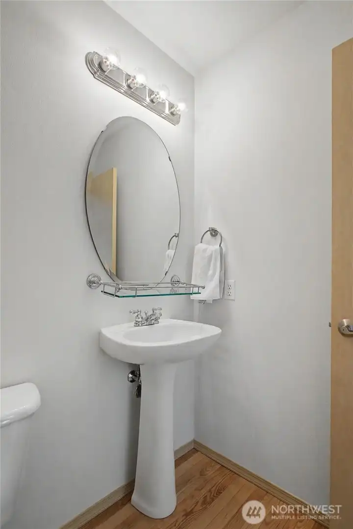 Half bath at bottom of staircase.