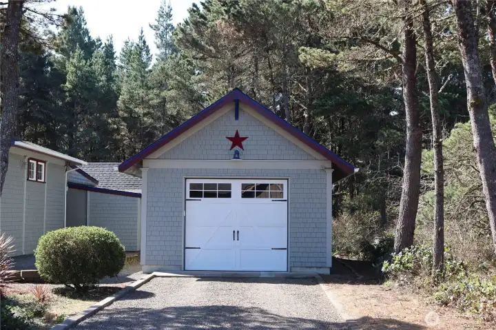 Detached single car garage with storage area in back