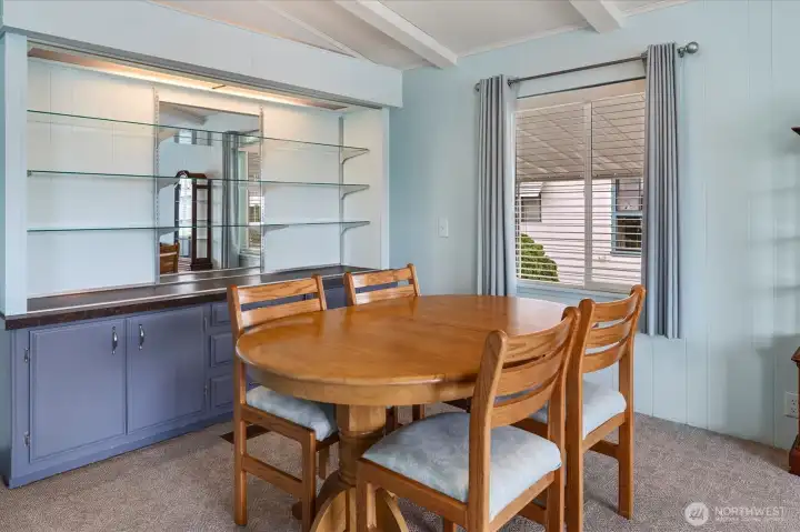 Dining area with built in cabinetry and shelving.