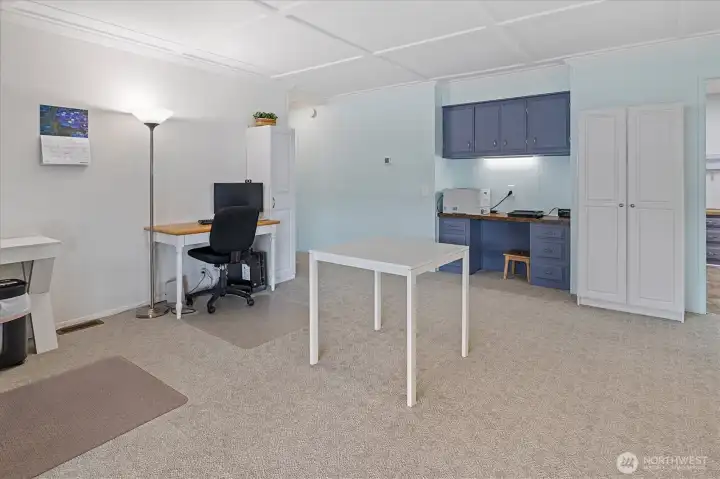 Living room with built in desk.