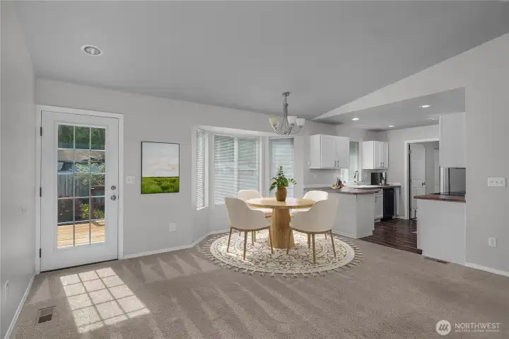 Virtually staged dinging space off kitchen and living room